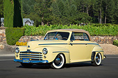 AUT 20 RK0648 01
1947 Ford Convertible Yellow 3/4 Front View On Pavement By Shrubs
