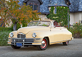 AUT 20 RK0651 01
1948 Packard Super 8 Convertible Arizona Beige 3/4 Front View On Pavement By House