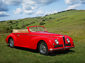 AUT 20 RK0654 01
1942 Alfa Romeo 6C 2500 Red 3/4 Front View On Grass By Hills