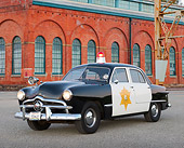AUT 20 RK0668 01
1949 Ford Police Car 3/4 Front View On Pavement By Brick Building
