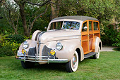 AUT 20 RK0669 01
1940 Pontiac Six Hercules Station Wagon Tan Woodie 3/4 Front View On Grass By Trees