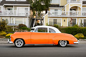 AUT 20 RK0672 01
1949 Chevrolet Coupe Sunset Pearl Profiel View On Pavement By Houses