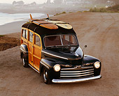 AUT 20 RK0015 04
1946 Ford Woody Green With Surfboard Overhead 3/4 Front View At Beach