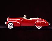 AUT 20 RK0027 02
1940 Packard Darrin Body Convertible Burgundy Profile View On Gray Line Studio