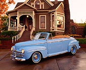 AUT 20 RK0052 03
1947 Ford Convertible Light Blue 3/4 Side View On Driveway By House