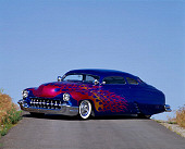 AUT 20 RK0058 03
1949 Mercury Custom Street Rod Blue With Flames 3/4 Front View On Pavement Hill Blue Sky