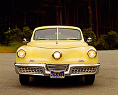 AUT 20 RK0098 12
1948 Tucker Torpedo Yellow Head On View By Trees