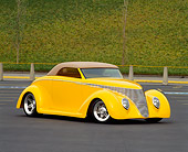 AUT 20 RK0133 04
1940 Ford Custom Sedan Yellow 3/4 Front View On Pavement