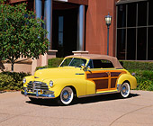 AUT 20 RK0142 01
1948 Chevrolet Country Club Convertible Low 3/4 Side View On Pavement By Building And Trees