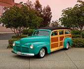 AUT 20 RK0172 02
1942 Ford Woodie Green 3/4 Front View On Pavement By Trees Filtered