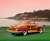 AUT 20 RK0176 03
1946 Chrysler Town & Country Burgundy 3/4 Rear View On Grass By Water Pebble Beach