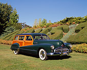 AUT 20 RK0186 01
1948 Buick Roadmaster Estate Wagon Green 3/4 Front View On Grass By Bushes