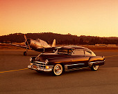 AUT 20 RK0212 03
1949 Cadillac Sedanette Dark Maroon With 1941 Voltree BT 13B Airplane