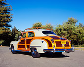 AUT 20 RK0244 04
1947 Chrysler Town & Country Woody Sedan Light Green Low 3/4 Rear View On Pavement Trees Blue Sky