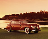AUT 20 RK0256 04
1941 Lincoln Continental Coupe Red 3/4 Side View On Grass By Water