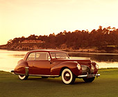 AUT 20 RK0256 05
1941 Lincoln Continental Coupe Red 3/4 Side View On Grass By Water