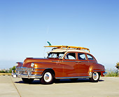 AUT 20 RK0272 06
1948 Chrysler Traveler Brown And Tan 3/4 Side View On Pavement With Surfboard