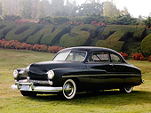 AUT 20 RK0333 01
1949 Mercury 2-Door Sedan Black 3/4 Front View On Grass By Shrubs And Trees