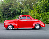 AUT 20 RK0346 01
1940 Ford Standard Coupe Red Profile View By Shrubs