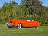 AUT 20 RK0359 01
1941 Chrysler Newport Dual Cowl Phaeton Red 3/4 Front View On Grass By Trees