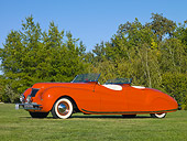 AUT 20 RK0360 01
1941 Chrysler Newport Dual Cowl Phaeton Red 3/4 Front View On Grass By Trees
