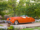 AUT 20 RK0362 01
1941 Chrysler Newport Dual Cowl Phaeton Red 3/4 Front View On Platform By Trees
