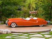 AUT 20 RK0363 01
1941 Chrysler Newport Dual Cowl Phaeton Red 3/4 Front View On Platform By Lake And Trees