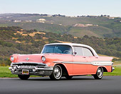 AUT 21 BK0021 01
1957 Pontiac Chieftain Coral And White 3/4 Front View On Pavement By Hills