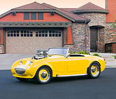 AUT 21 BK0023 01
1958 Austin-Healey Sprite (AKA Bugeye) Convertible Hot Rod Yellow 3/4 Front View On Pavement By House