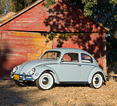 AUT 21 BK0030 01
1957 Volkswagen Beetle Light Blue 3/4 Side View On Dirt By Barn