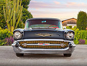 AUT 21 BK0039 01
1957 Chevrolet Bel Air Black Front View On Pavement By Cactus, Shrubs And Barn