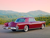 AUT 21 BK0044 01
1956 Lincoln Continental Red 3/4 Rear View On Pavement By Trees