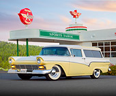 AUT 21 BK0053 01
1957 Ford Del Rio Ranch Wagon Yellow And White 3/4 Front View On Pavement By Gas Station