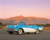AUT 21 RK0082 02
1957 Buick Special Convertible Blue & White 3/4 Front View On Pavement By Mountain