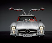 AUT 21 RK0115 02
1956 Mercedes-Benz 300SL Gullwing Silver Doors Up Headlights On Studio Background