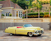 AUT 21 RK0248 01
1953 Yellow Cadillac Eldorado Convertible 3/4 Side On Pavement By House Headlights On