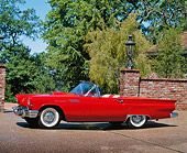 AUT 21 RK0271 01
1957 Ford Thunderbird E Type Red Convertible 3/4 Front View On Pavement By Brick Wall Trees