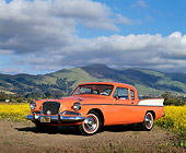 AUT 21 RK0397 05
1958 Orange Studebaker Commander 3/4 Front View By Field Of Yellow Flowers