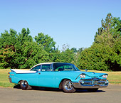 AUT 21 RK0460 03
1959 Dodge Coronet Turquoise 3/4 Front View On Pavement By Grass And Trees Blue Sky