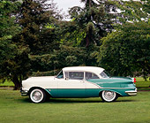 AUT 21 RK0529 01
1956 Oldsmobile Super 88 Green & White profile on grass with trees in background
