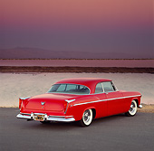 AUT 21 RK0616 04
1955 Chrysler C-300 3/4 Rear View On Pavement By Water Purple Sky