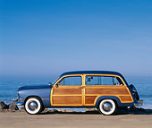 AUT 21 RK0694 08
1950 Ford Woody Blue Profile On Pavement By Ocean Blue Sky