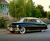 AUT 21 RK0733 08
1950 Mercury Monterey Convertible Black 3/4 Front View On Pavement By House And Trees