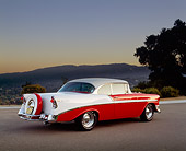 AUT 21 RK0833 09
1956 Chevy Bel Air Red And White 3/4 Rear View On Pavement Mountains And Trees At Dusk