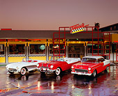 AUT 21 RK0926 02
1955 Pontiac Starchief 1957 Corvette 1955 Chevy Bel Air Front 3/4 View On Wet Pavement Headlights Taxis