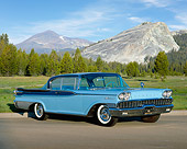 AUT 21 RK1016 02
1959 Mercury Parklane 2DR HT Cruiser Blue 3/4 Front View On Pavement By Grass And Palm Trees Blue Sky