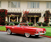 AUT 21 RK1082 01
1955 Ford Thunderbird Convertible Red 3/4 Rear View On Pavement By Building