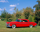AUT 21 RK1138 01
1955 Chrysler C-300 Red 3/4 Side View On Grass By Trees Blue Sky