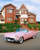 AUT 21 RK1157 07
1957 Ford Thunderbird Convertible Pink 3/4 Front View On Pavement By House