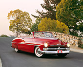 AUT 21 RK1169 04
1950 Mercury Convertible Dark Red 3/4 Front View On Pavement By Stone Bridge And Trees